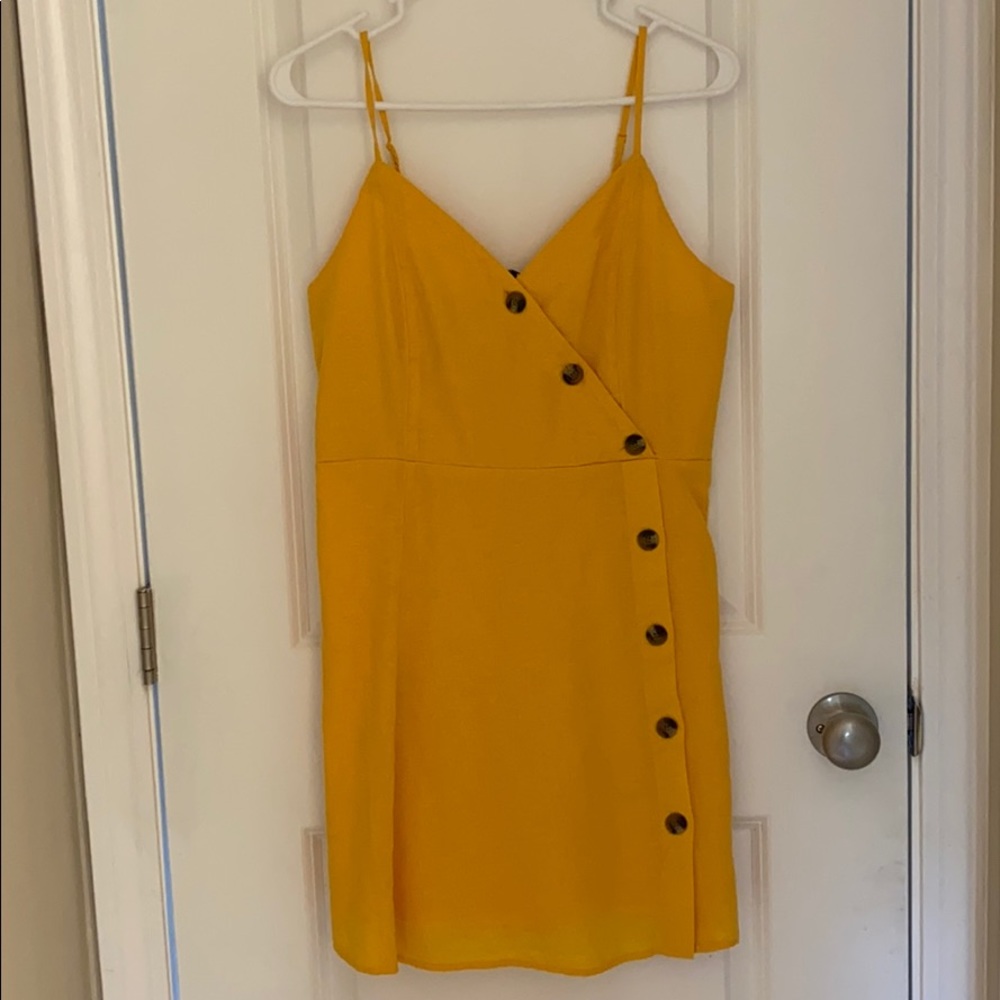 BRAND NEW! Gold dress with brown button detail.